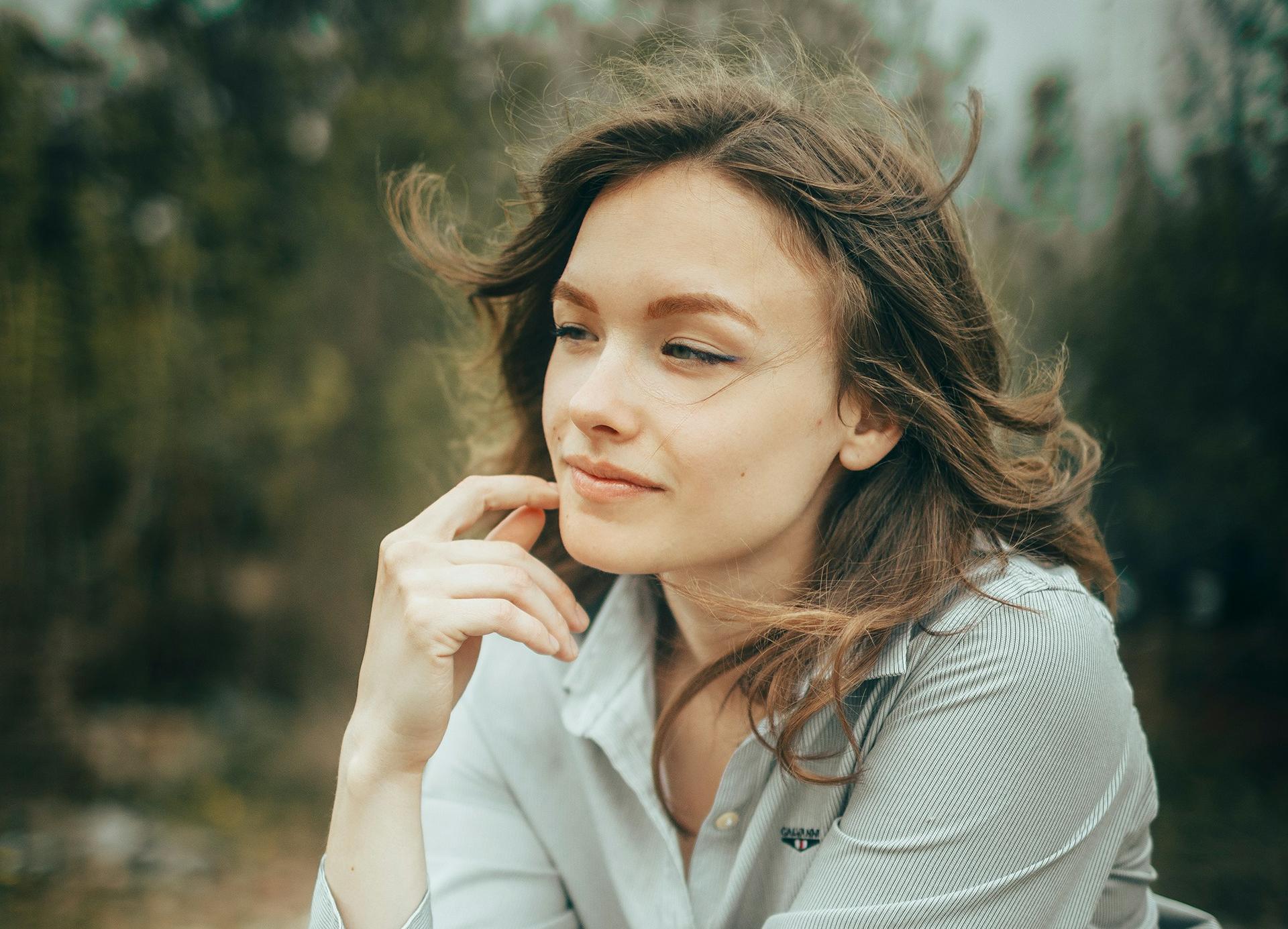 Young adult reflecting outside